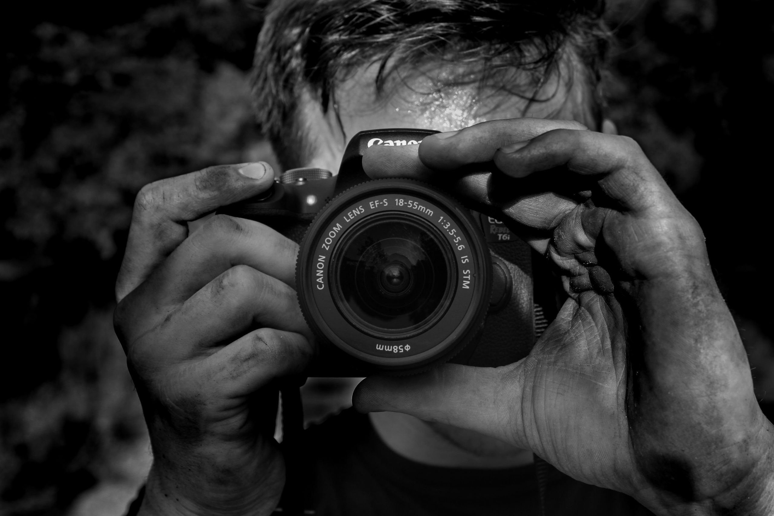 man pointing a camera toward the viewer