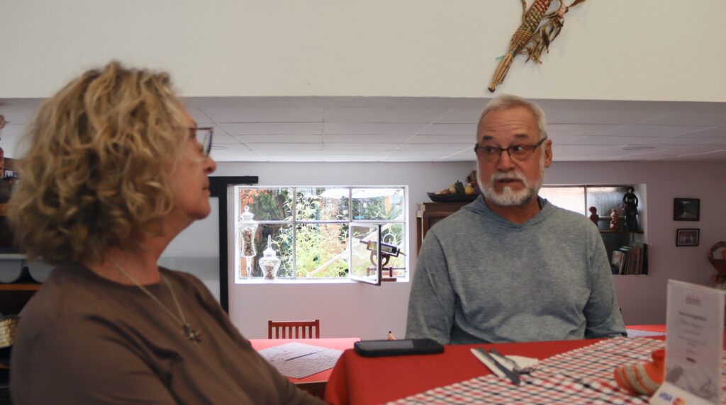 a man and woman looking at each other