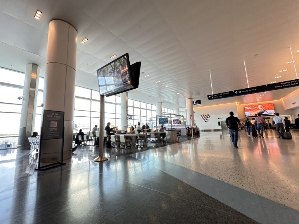 Passengers walking through Houston airport 