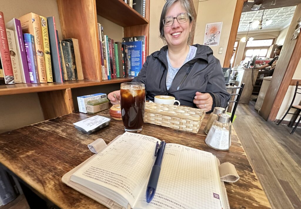 a woman at a table in a cafe
