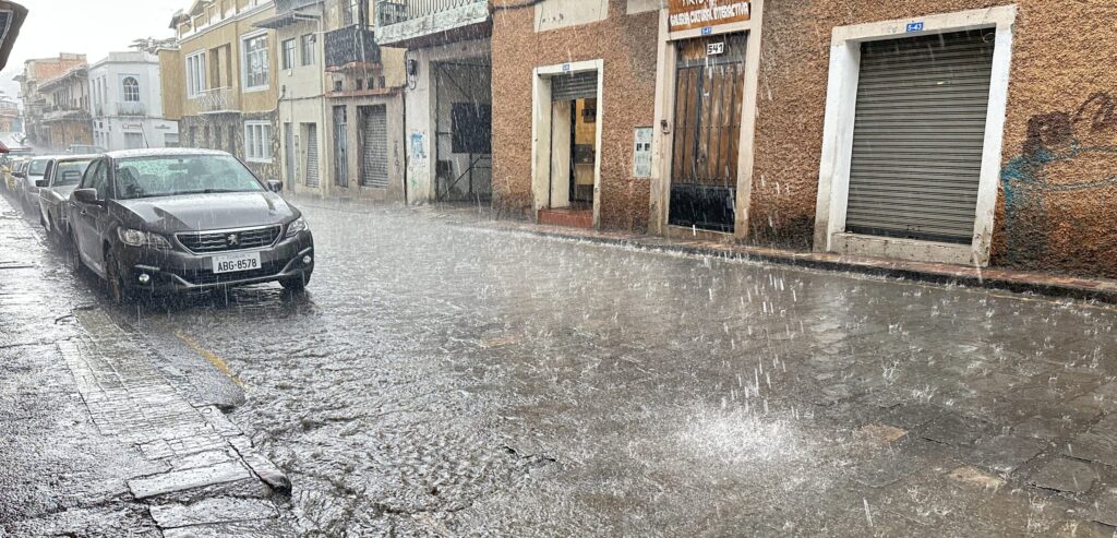 heavy rain on a cobblestone street in Cuenca Ecuador