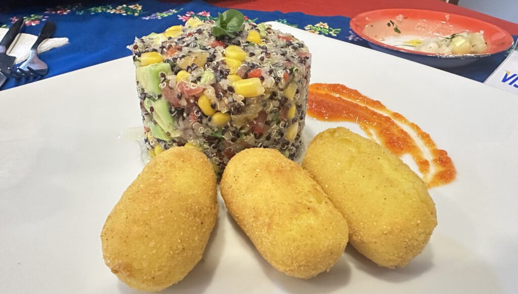 A quinoa salad with yuca fritters