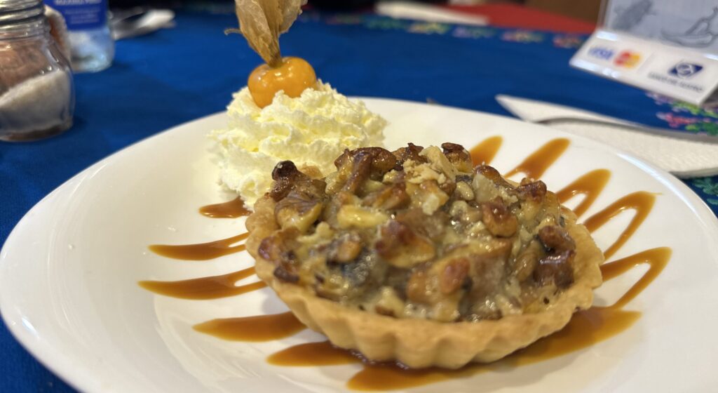 small pecan pie with cream