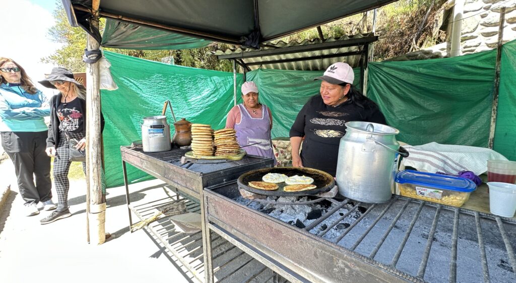 Two women making tortillas