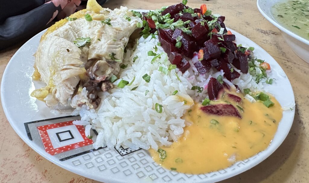 Chicken over rice with beets and sauce