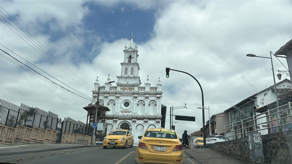 The view of a church at the top of a hill
