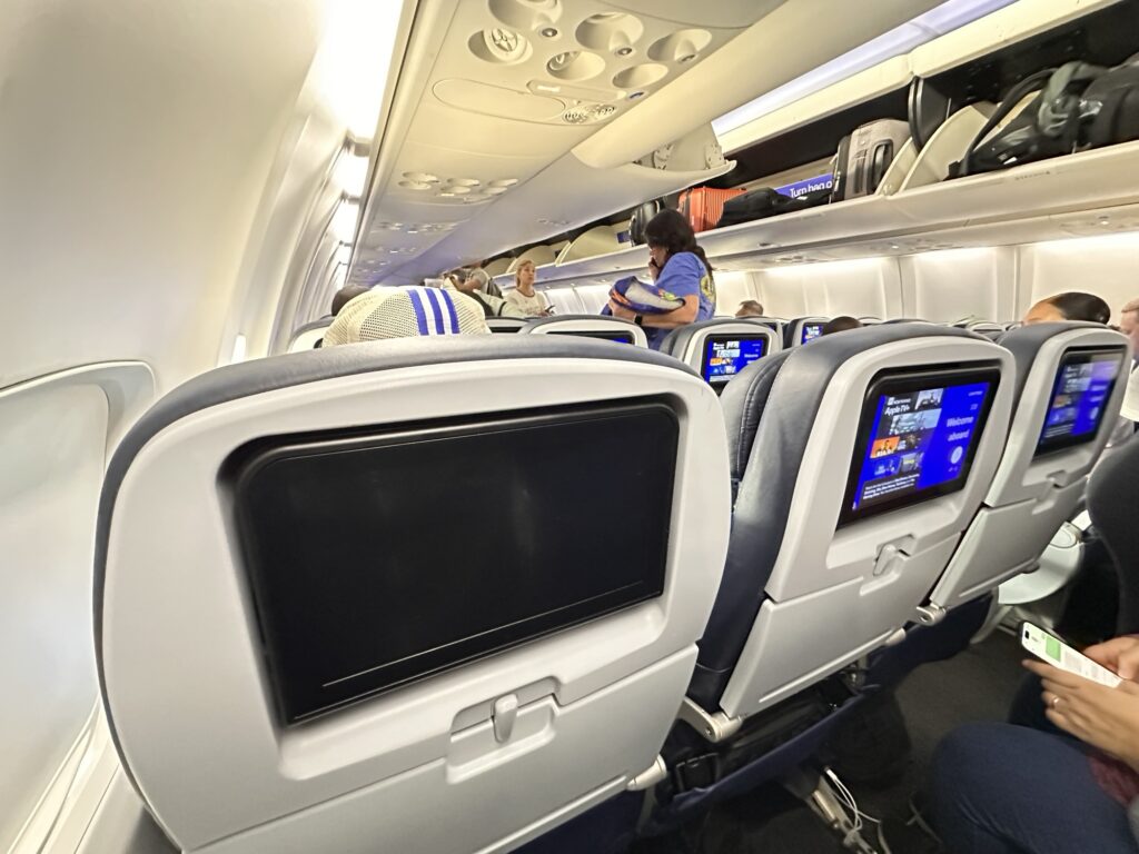 The inside of a United Airlines flight. 