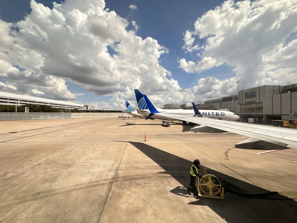 Looking out the plane window at a sunny day at Austin airport 
