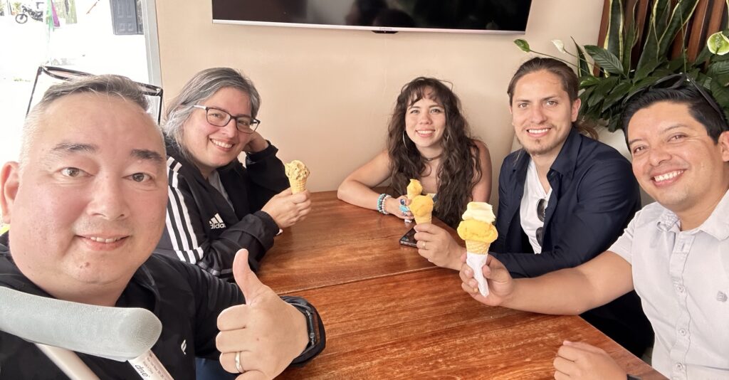 A group enjoying ice cream around a table