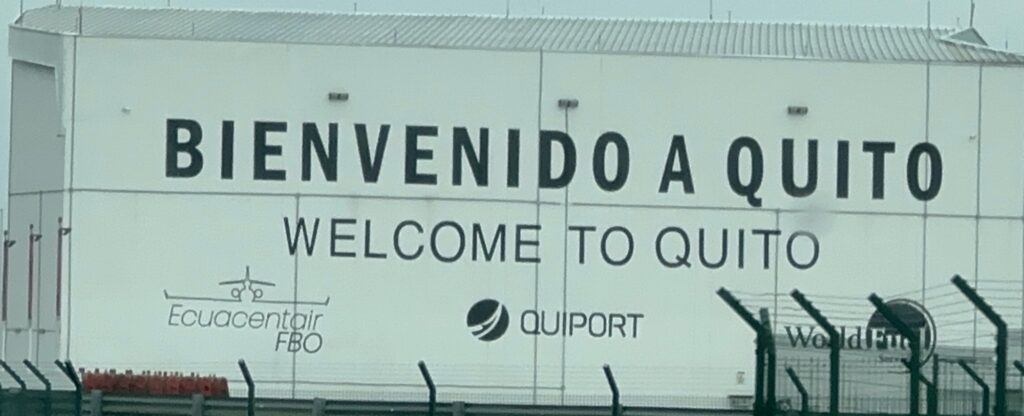 A sign saying "Welcome to Quito"