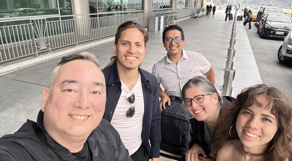 Friends on the curb at Quito airport