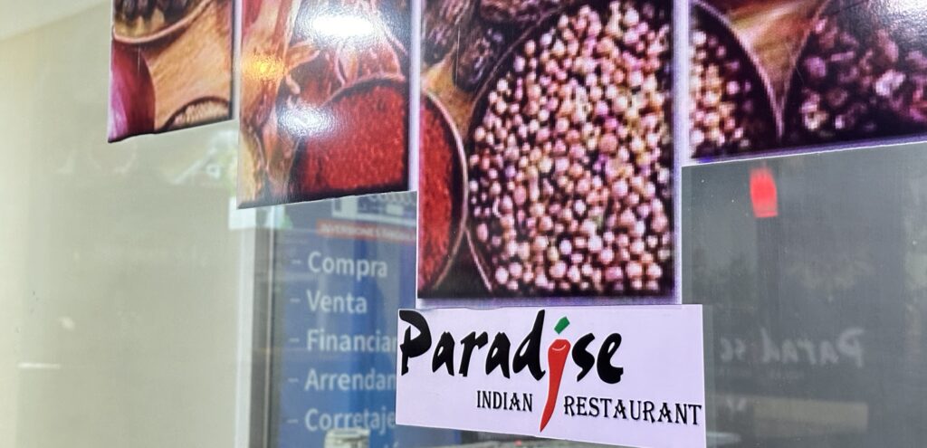 A sign for Paradise Indian Restaurant