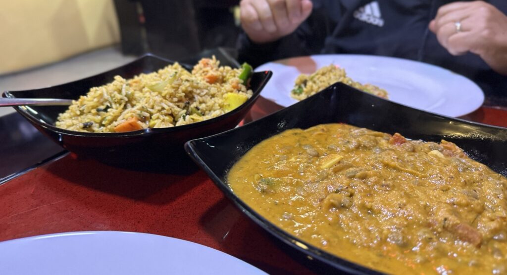 A vegetable biryani and a lentil dish
