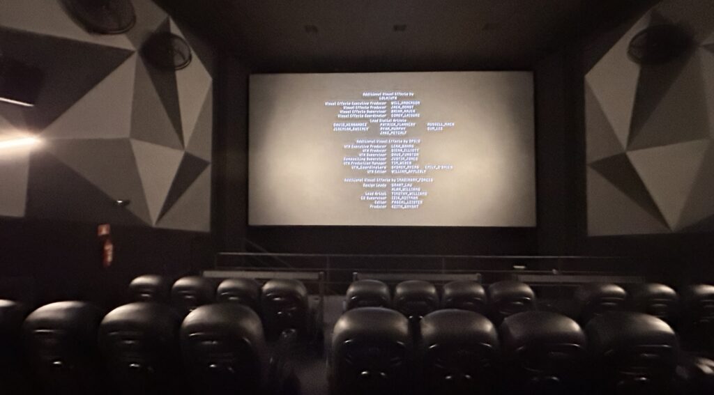 Ending credits on a theater screen