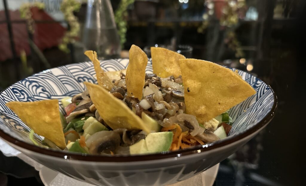A salad with tortilla chips
