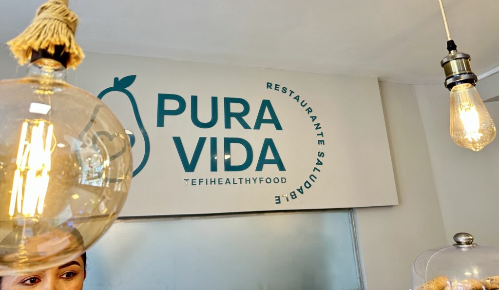 A sign for Pura Vida restaurant