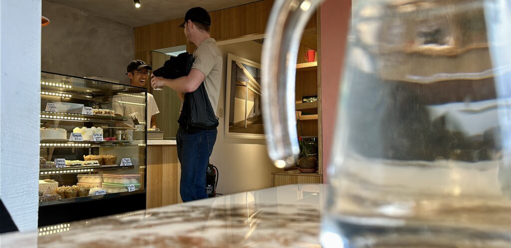 Kai is chatting with a customer