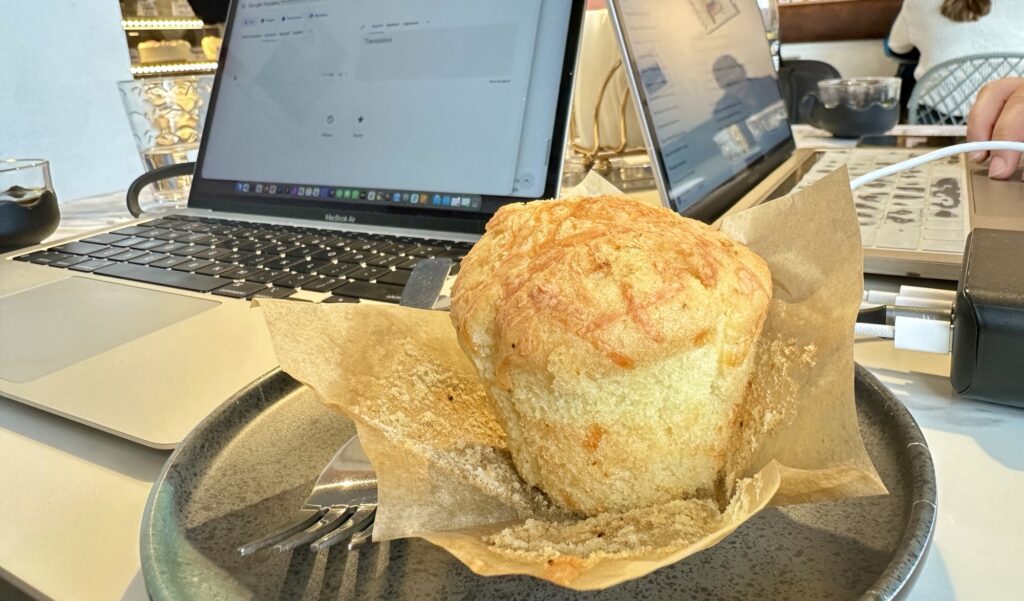 a muffin next to computers