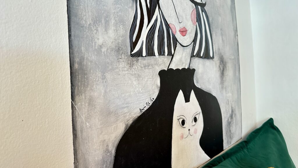 painting of woman and cat