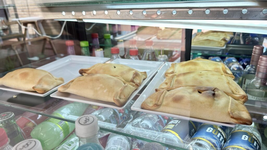 empenadas in a glass display case