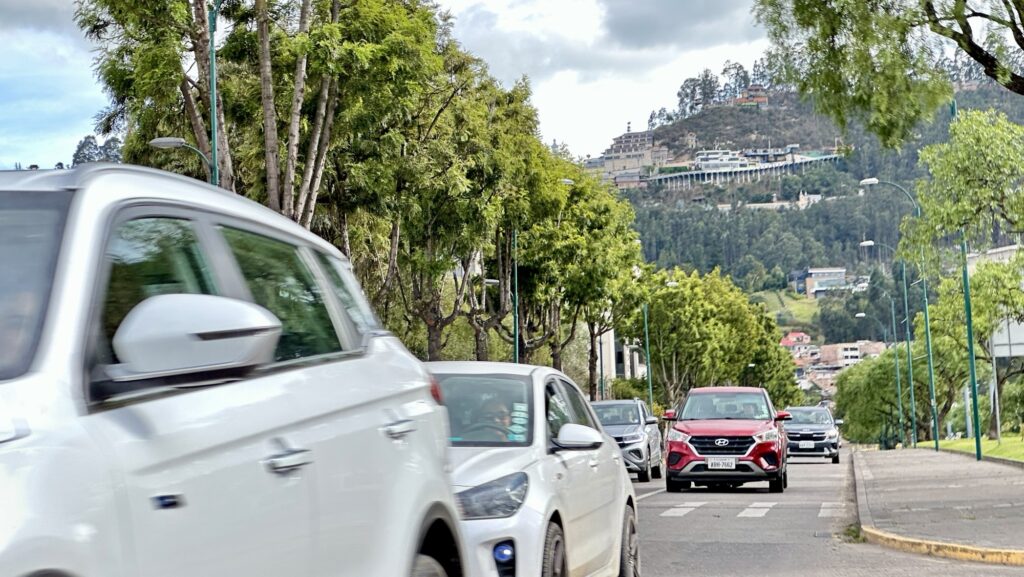 a street with a hill in background