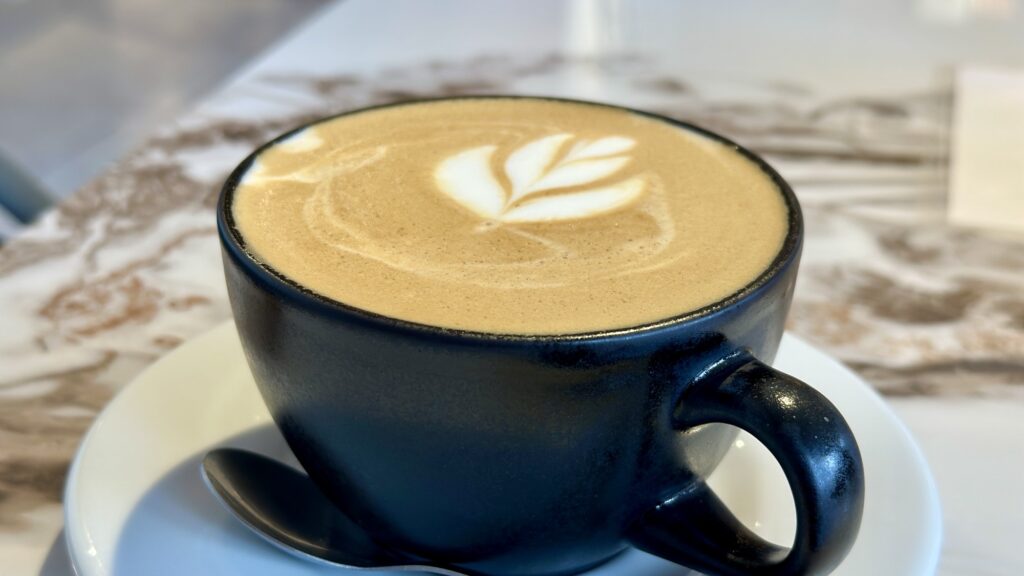 A flat white coffee drink