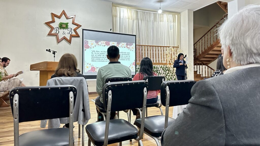 a woman speaking to a room