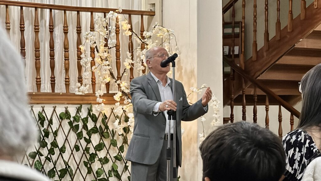 a man singing to a group