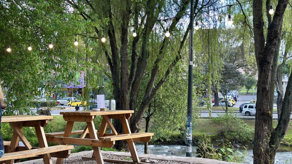 picnic tables near a river