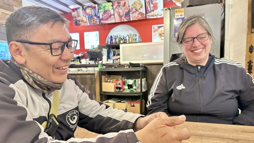 two people laughing during dinner