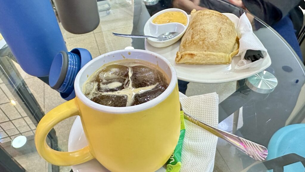Iced Americano and a chicken empanada