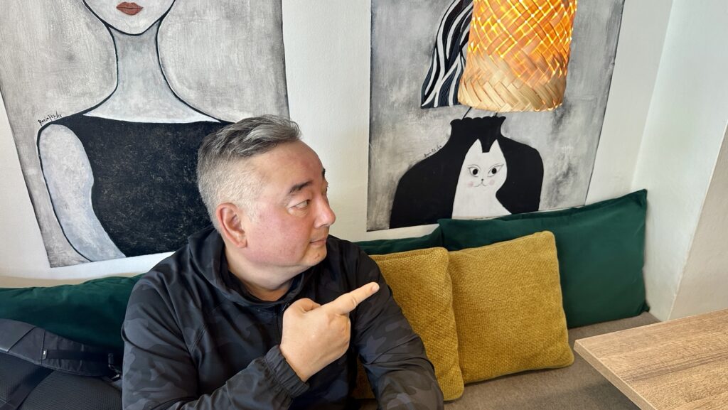 man pointing a mural