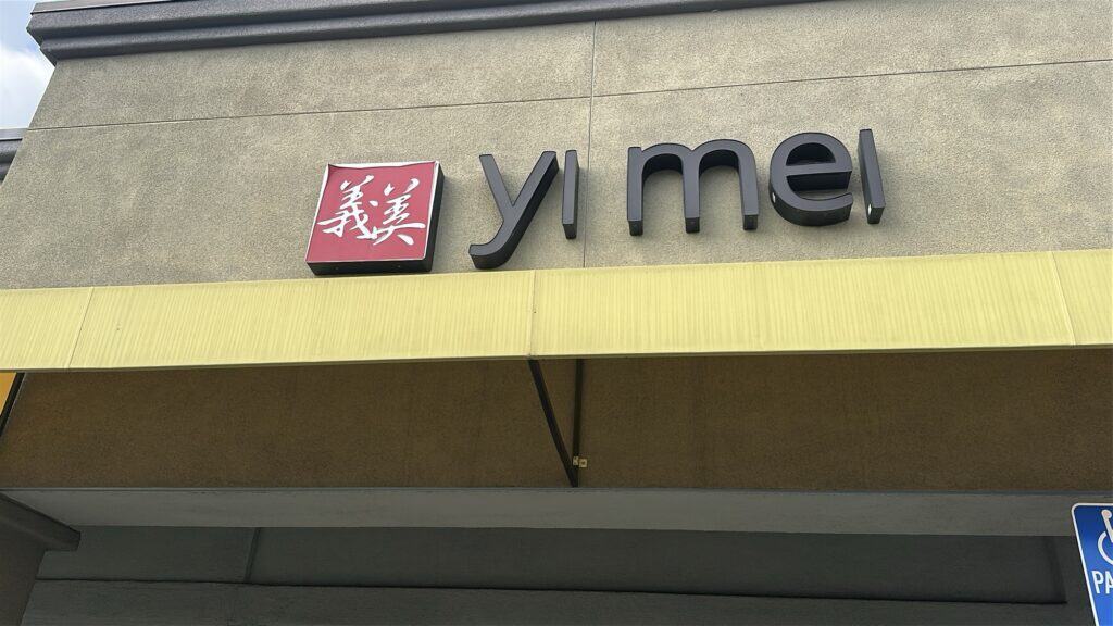 A sign for Yi Mei restaurant