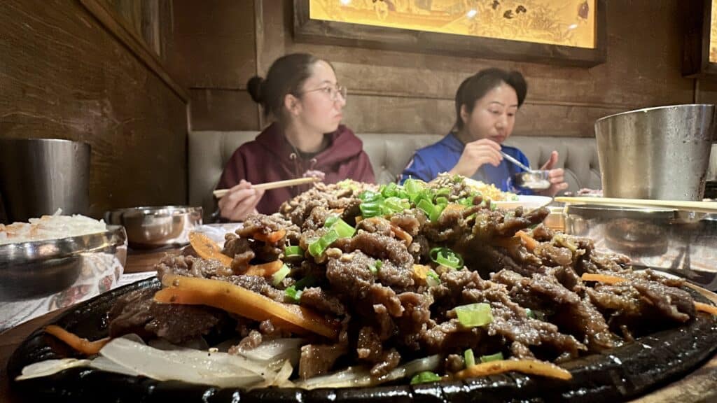 bulgogi on the table in front of two women